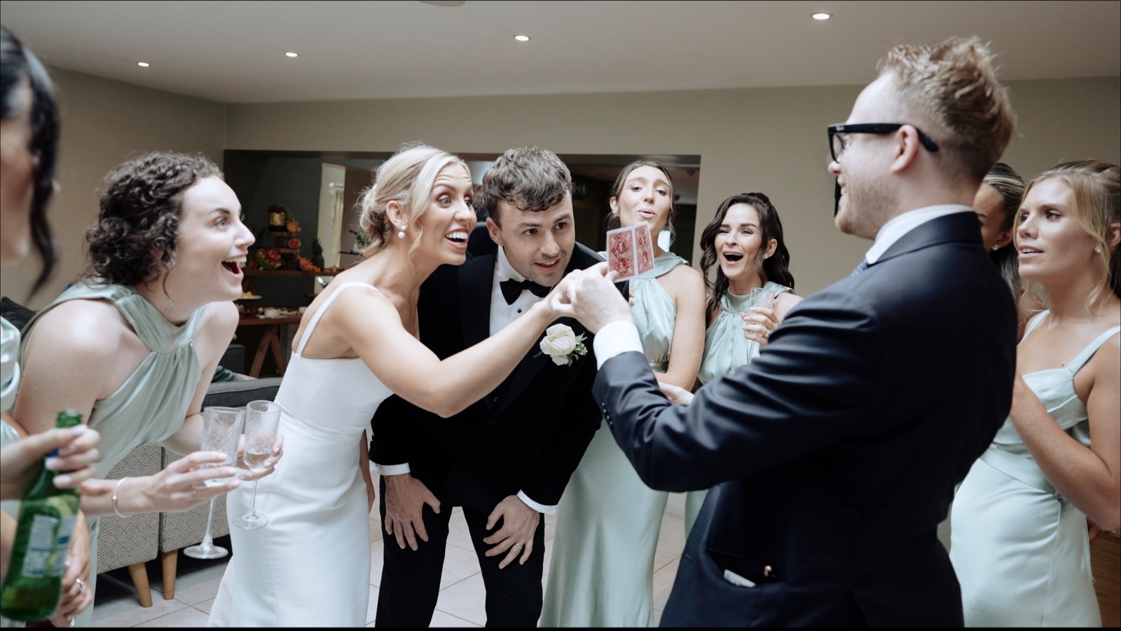 Bride and groom astonished by a card reveal