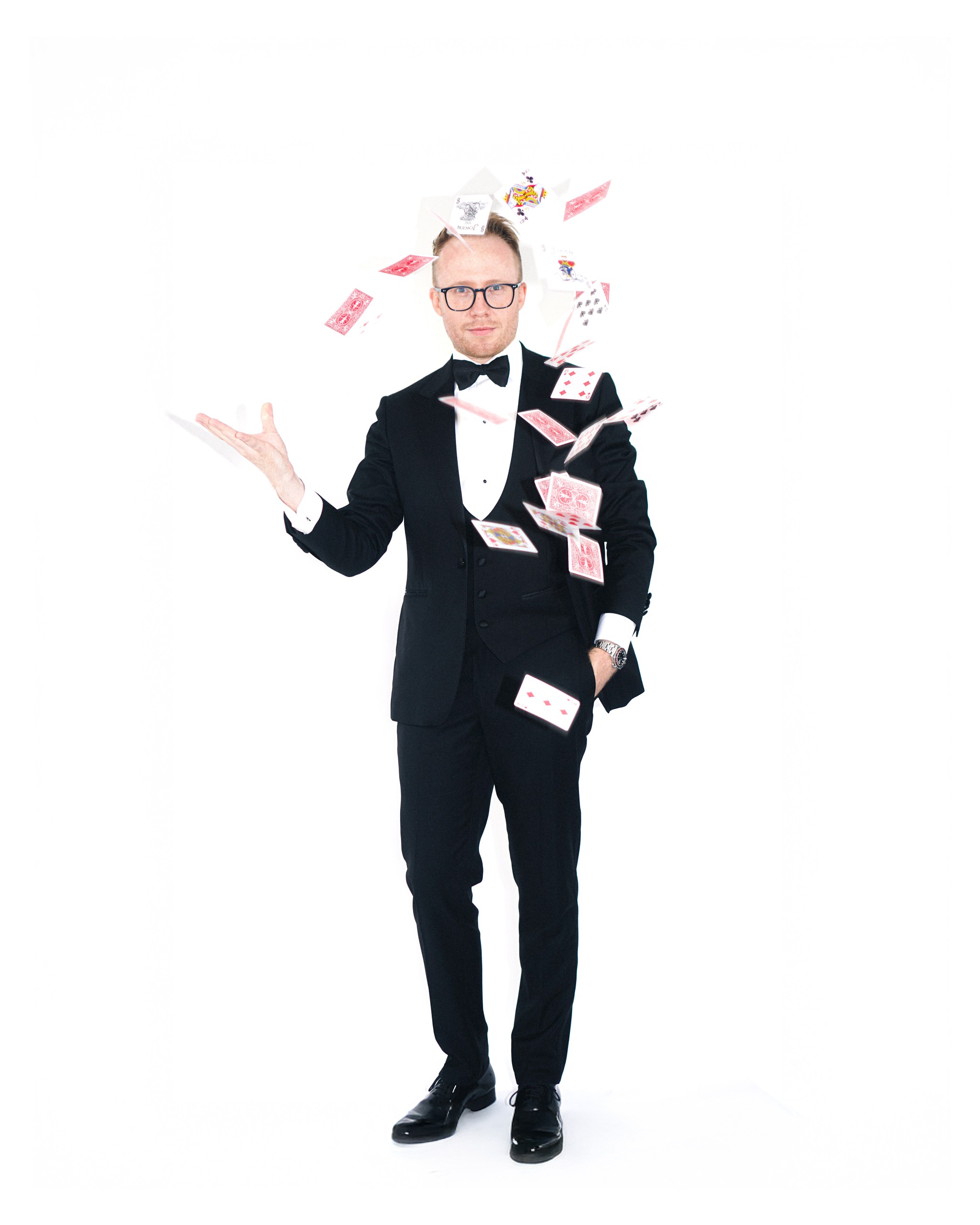 Kristian Grey performing with playing cards in mid-air